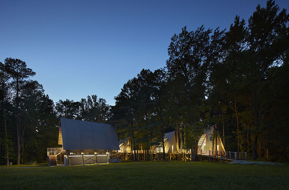 camp graham girl scout treehouses at kerr lake at night